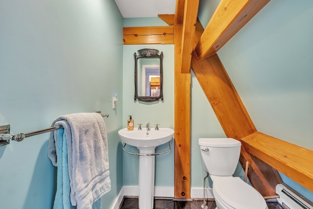 89 Kittery Avenue Rowley, MA 01969 - Photo 19 of 37 a bathroom with a sink mirror and toilet