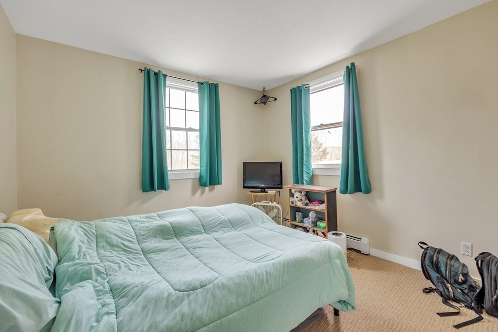 89 Kittery Avenue Rowley, MA 01969 - Photo 28 of 37 a bedroom with a bed and a window