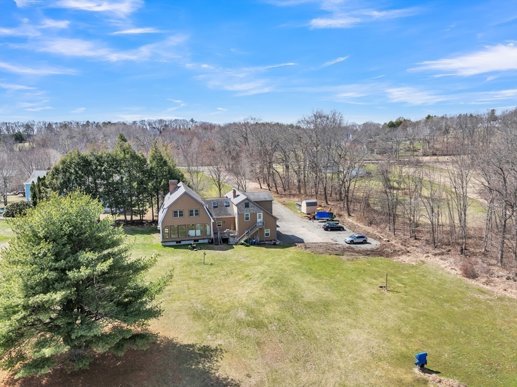89 Kittery Avenue Rowley, MA 01969 - Photo 3 of 37 a view of a lake with a mountain in the background