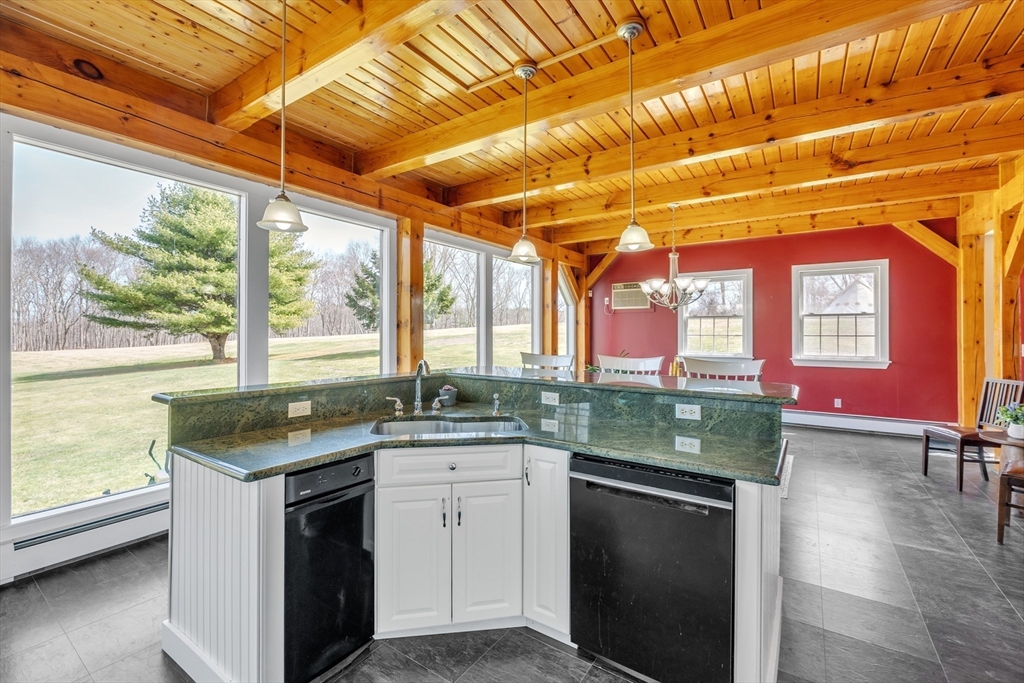 89 Kittery Avenue Rowley, MA 01969 - Photo 5 of 37 a kitchen with a stove sink and cabinets
