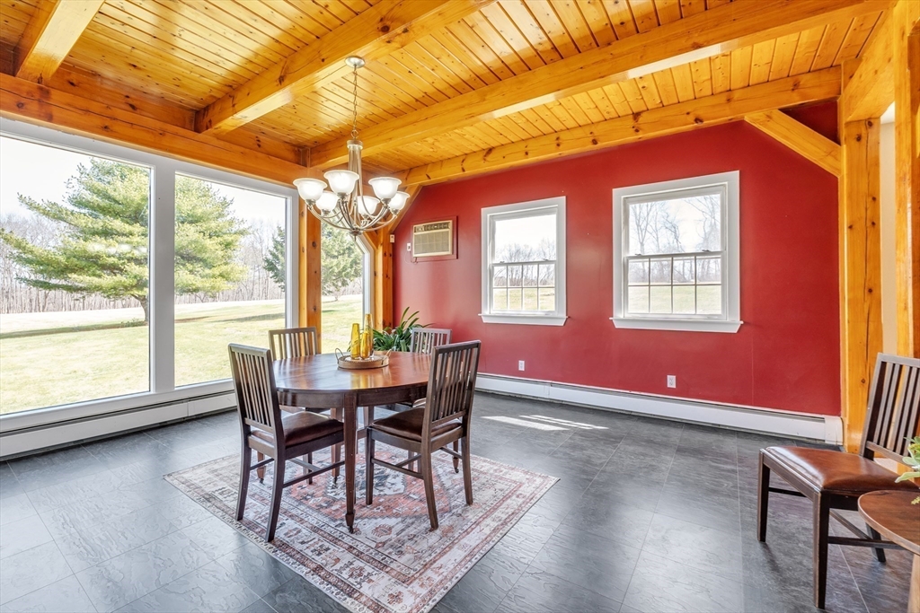 89 Kittery Avenue Rowley, MA 01969 - Photo 7 of 37 a dining room with furniture and wooden floor