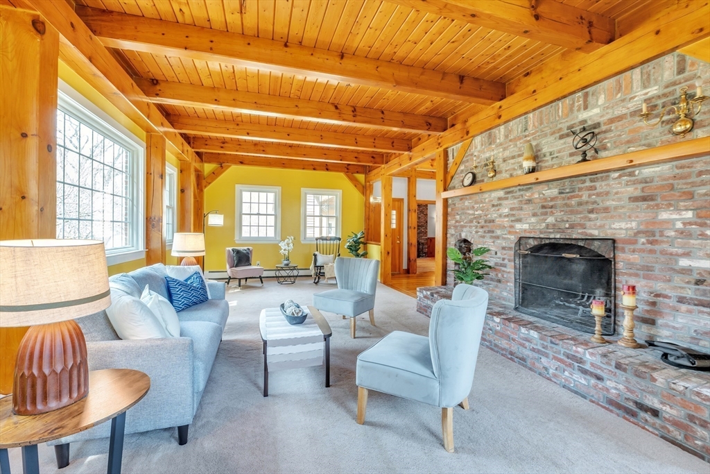89 Kittery Avenue Rowley, MA 01969 - Photo 9 of 37 a living room with furniture and a fireplace
