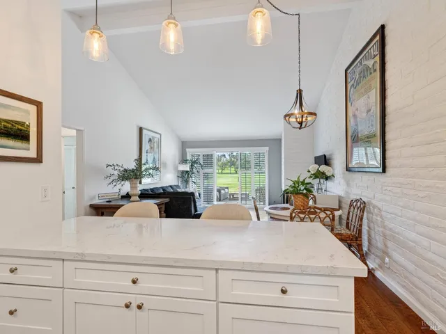 a view of living room with furniture and potted plants