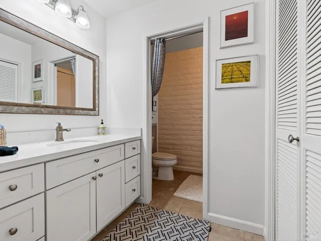 a bathroom with a sink a bath tub and a shower curtain