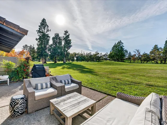 a view of a swimming pool with a patio