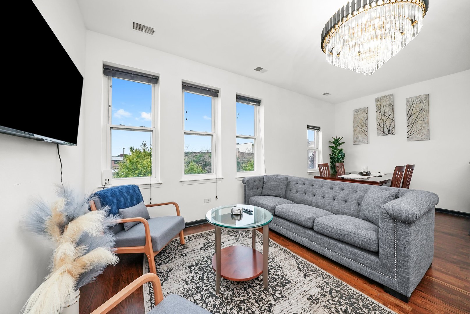 2432 West Harrison Street, Unit 3 Chicago, IL 60612 - Photo 12 of 32 a living room with furniture and a flat screen tv