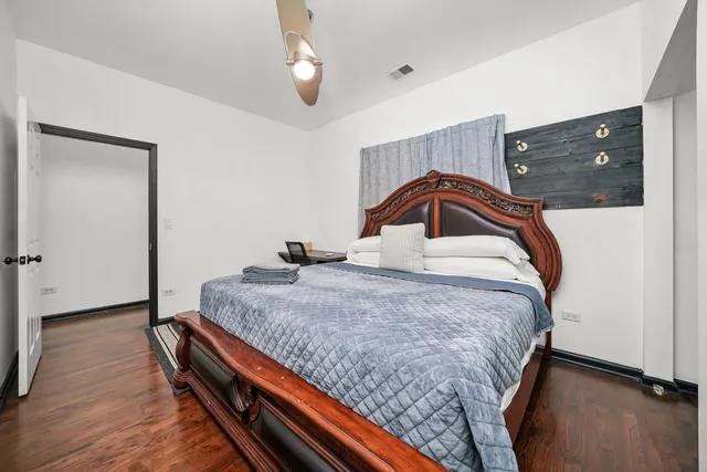 a bedroom with a bed and a dresser