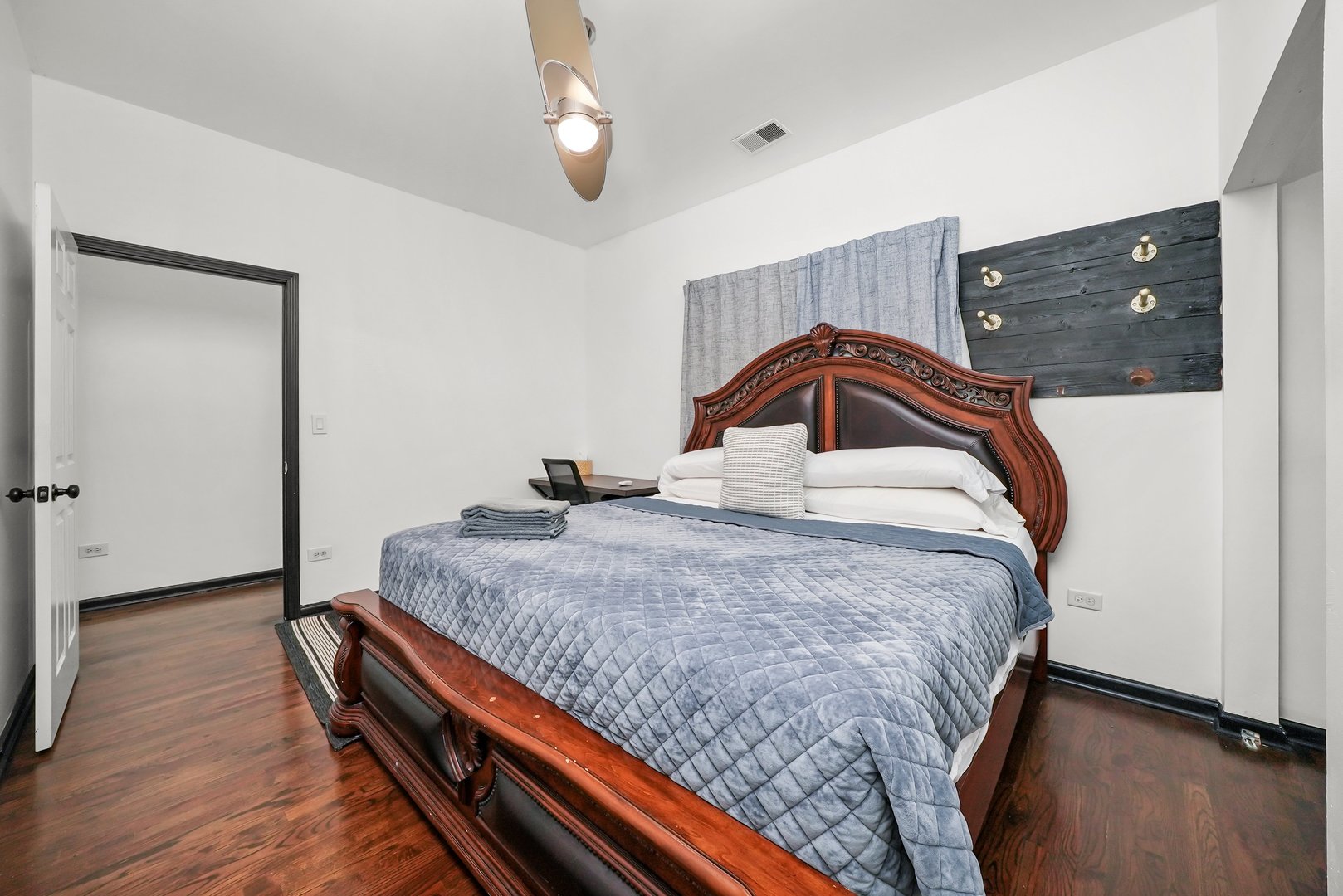 2432 West Harrison Street, Unit 3 Chicago, IL 60612 - Photo 27 of 32 a bedroom with a bed and a dresser