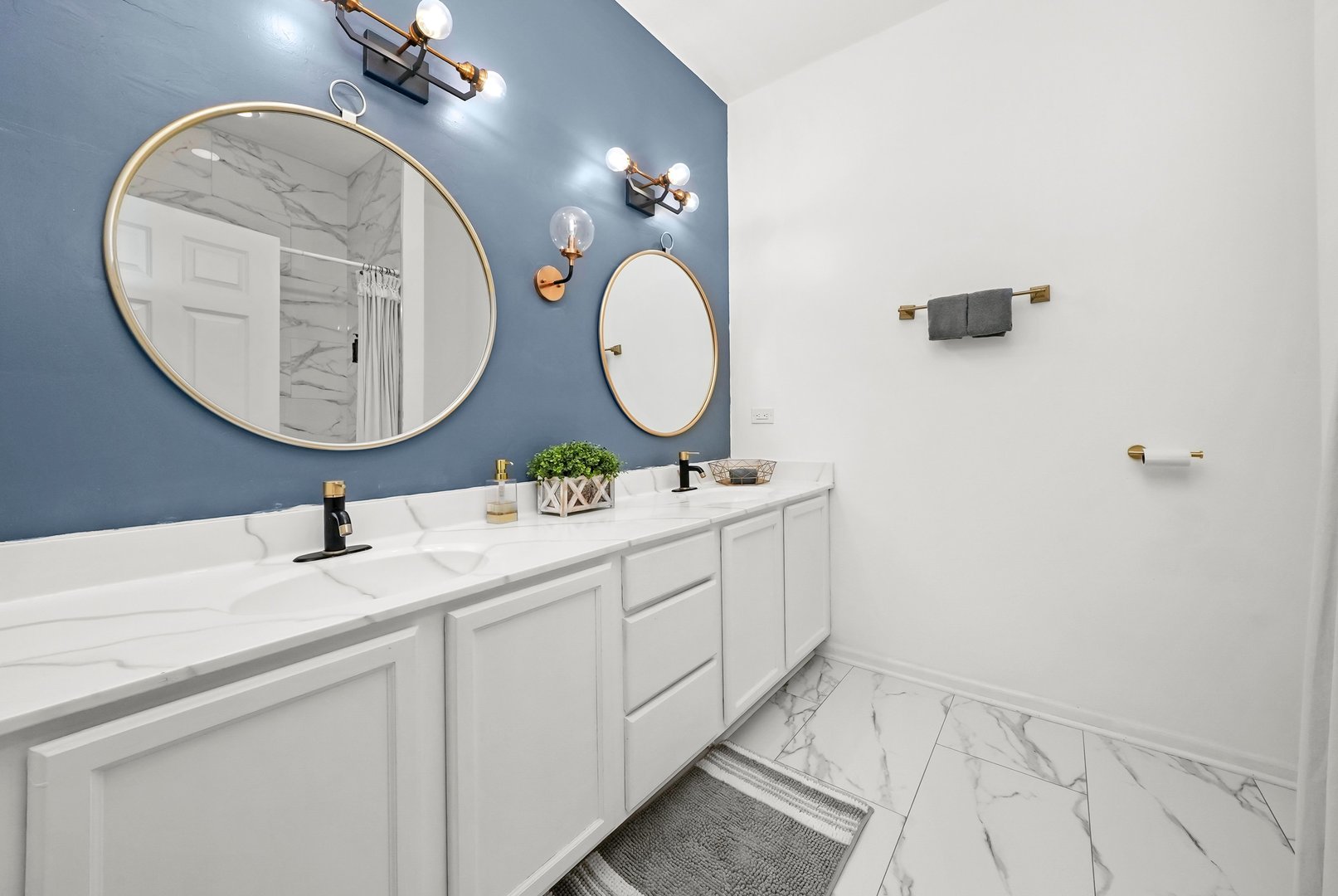 2432 West Harrison Street, Unit 3 Chicago, IL 60612 - Photo 29 of 32 a bathroom with a sink and a mirror