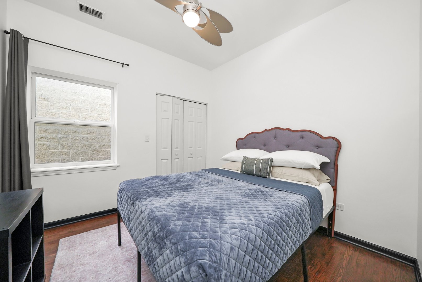 2432 West Harrison Street, Unit 3 Chicago, IL 60612 - Photo 31 of 32 a bedroom with a bed and a window