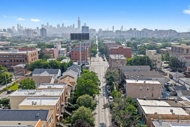 an aerial view of a city with lots of residential buildings