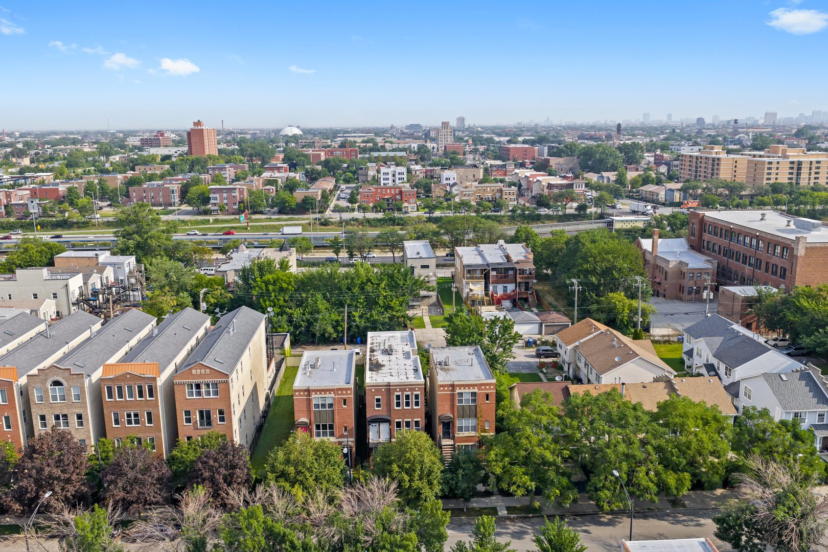 2432 West Harrison Street, Unit 3 Chicago, IL 60612 - Photo 8 of 32 an aerial view of residential houses with city view