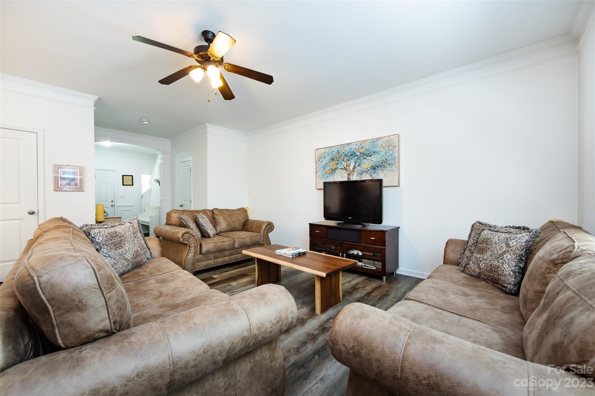 807 Rook Road Charlotte, NC 28216 - Photo 11 of 43 a living room with furniture and a flat screen tv
