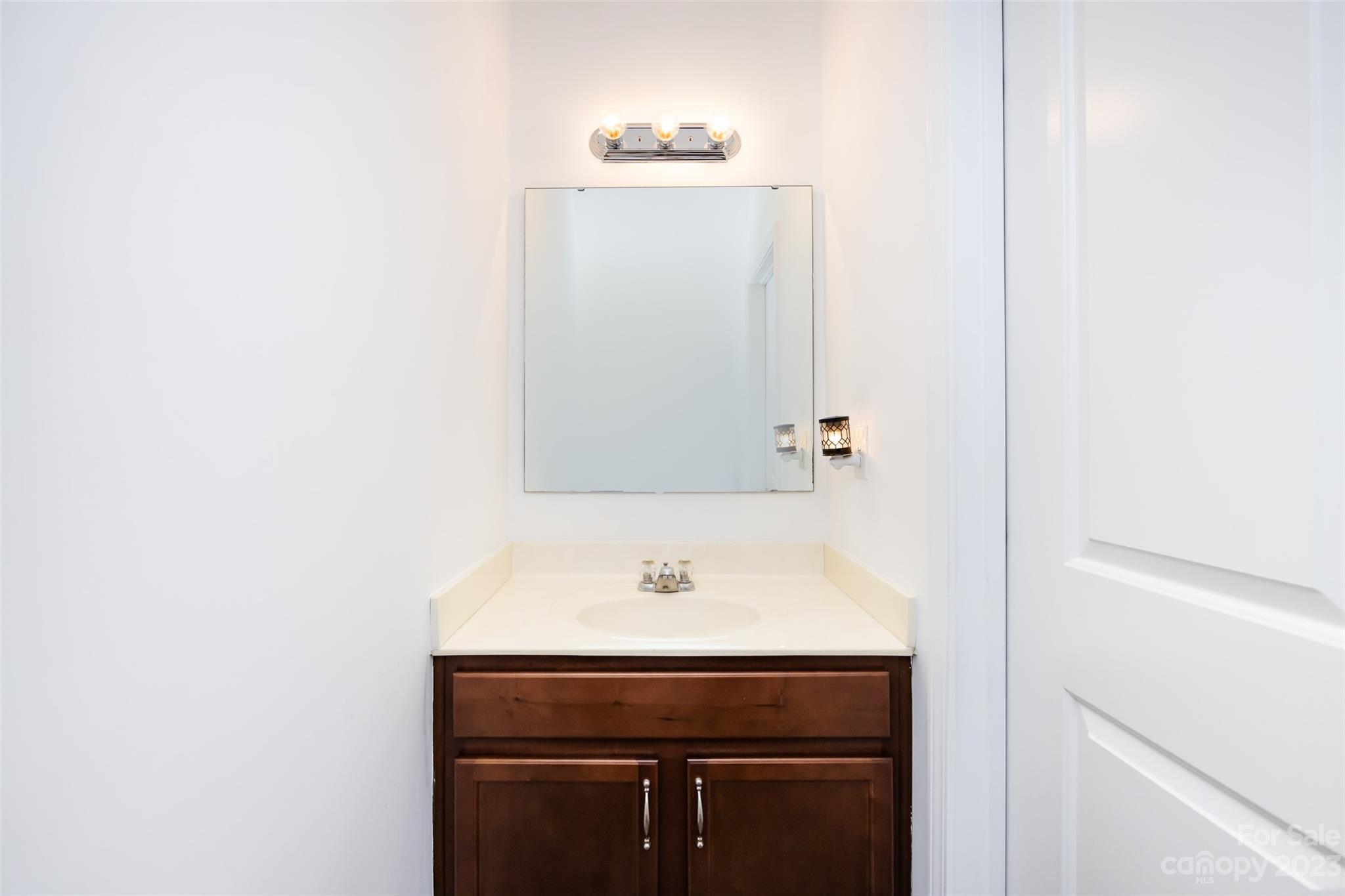 807 Rook Road Charlotte, NC 28216 - Photo 22 of 43 a sink with a mirror