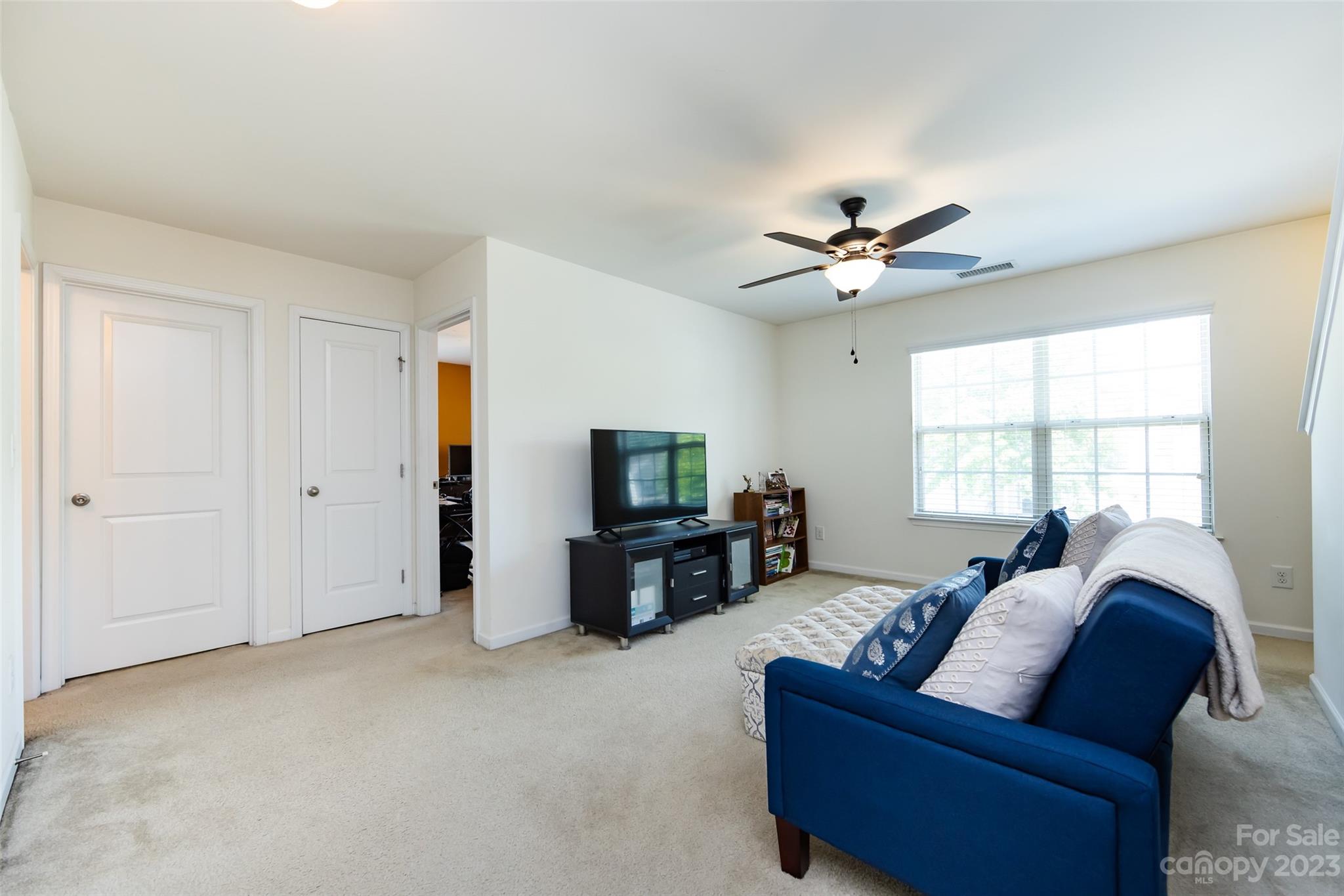 807 Rook Road Charlotte, NC 28216 - Photo 24 of 43 a living room with furniture and a flat screen tv