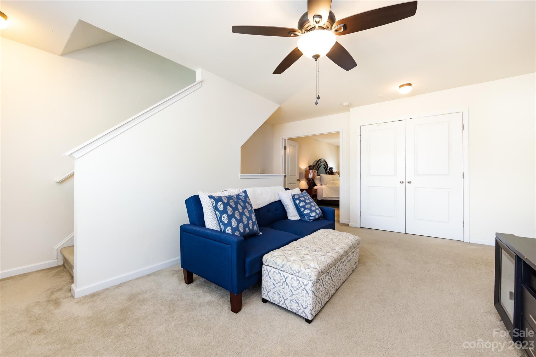 807 Rook Road Charlotte, NC 28216 - Photo 26 of 43 a living room with furniture and a ceiling fan