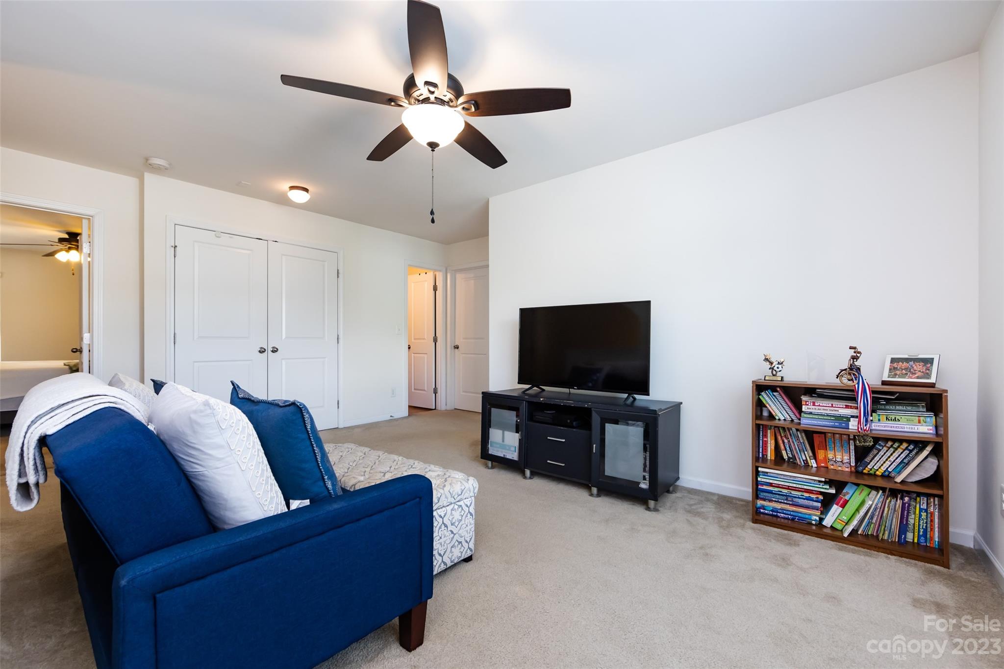 807 Rook Road Charlotte, NC 28216 - Photo 27 of 43 a living room with furniture and a flat screen tv