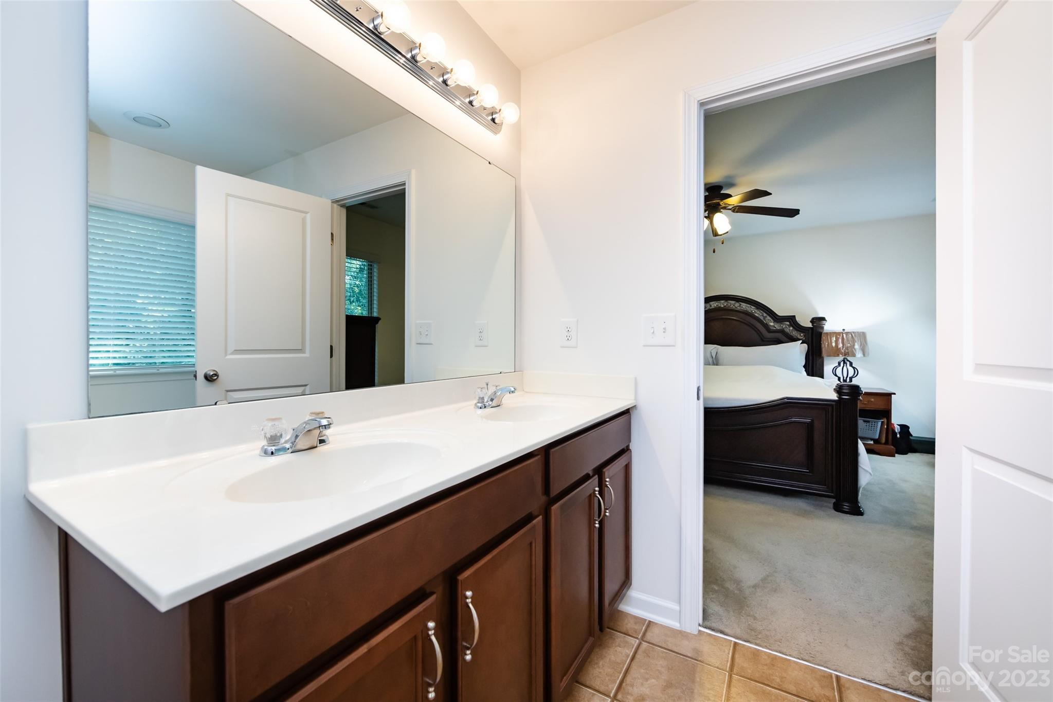 807 Rook Road Charlotte, NC 28216 - Photo 31 of 43 a en suite bathroom with a sink and a mirror