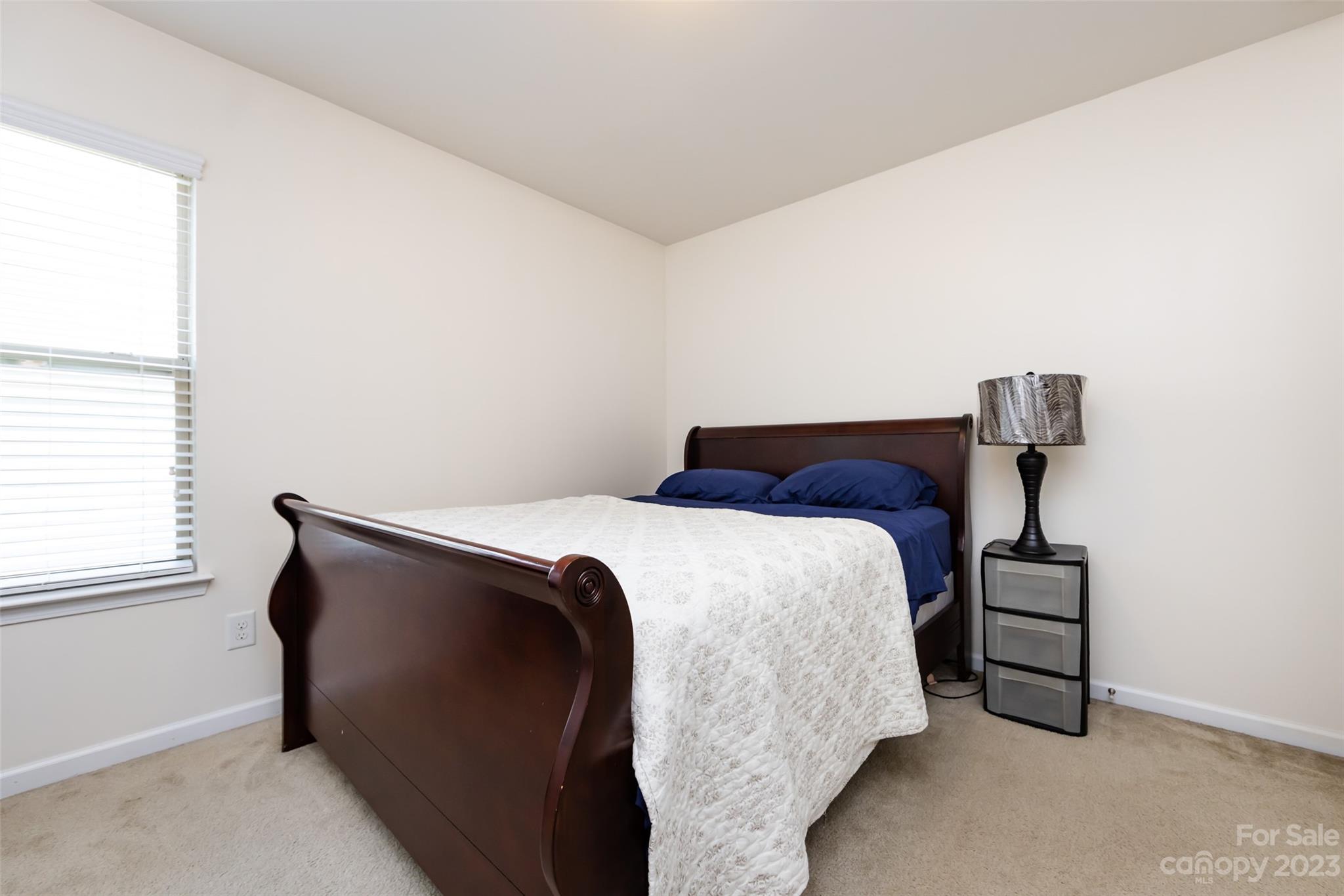 807 Rook Road Charlotte, NC 28216 - Photo 38 of 43 a bedroom with a bed and window