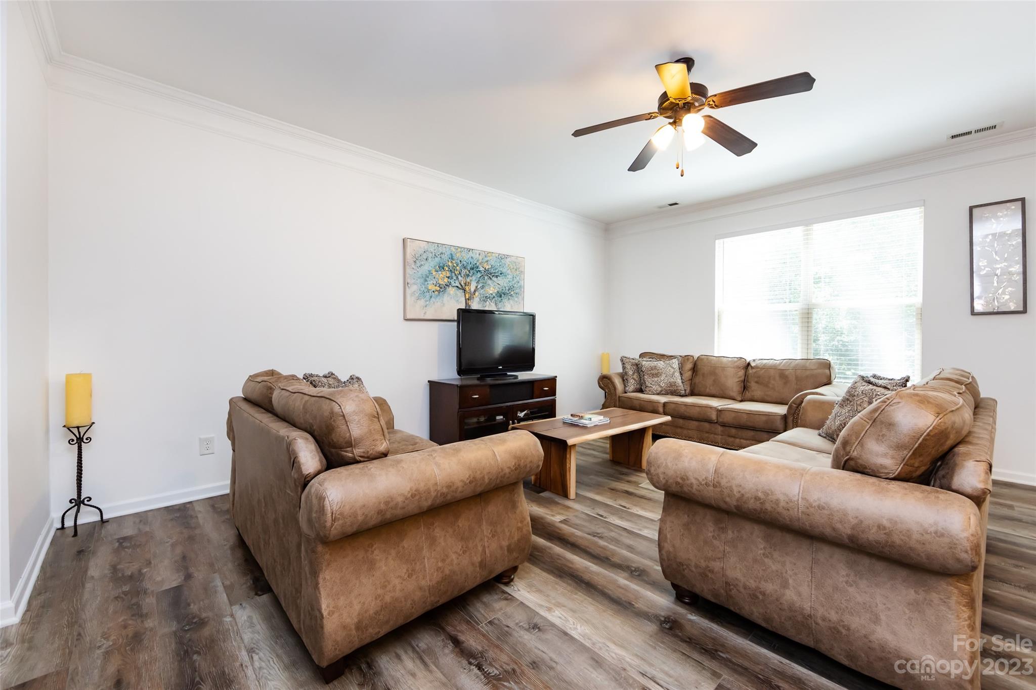 807 Rook Road Charlotte, NC 28216 - Photo 8 of 43 a living room with furniture and a flat screen tv