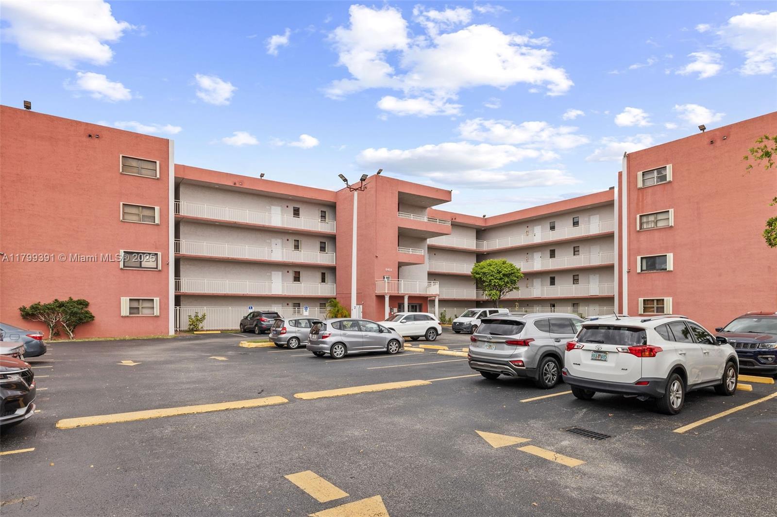 8401 Northwest 8th Street, Unit 401 Miami, FL 33126 - Photo 2 of 35 a buildings with car parked in front of it