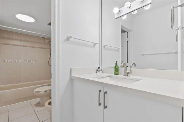 a bathroom with a bathtub a toilet and a shower