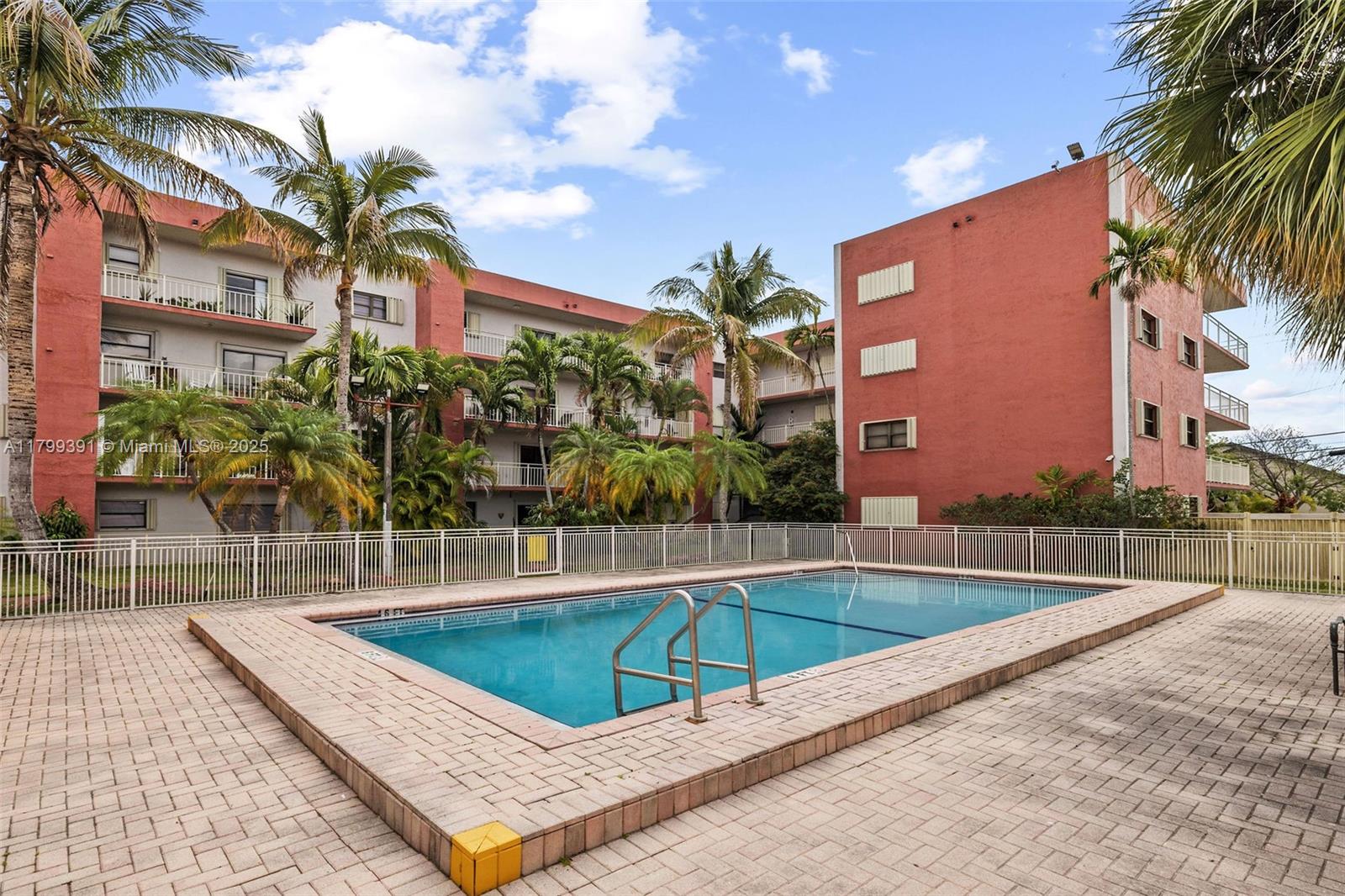 8401 Northwest 8th Street, Unit 401 Miami, FL 33126 - Photo 3 of 35 a view of a swimming pool with a patio