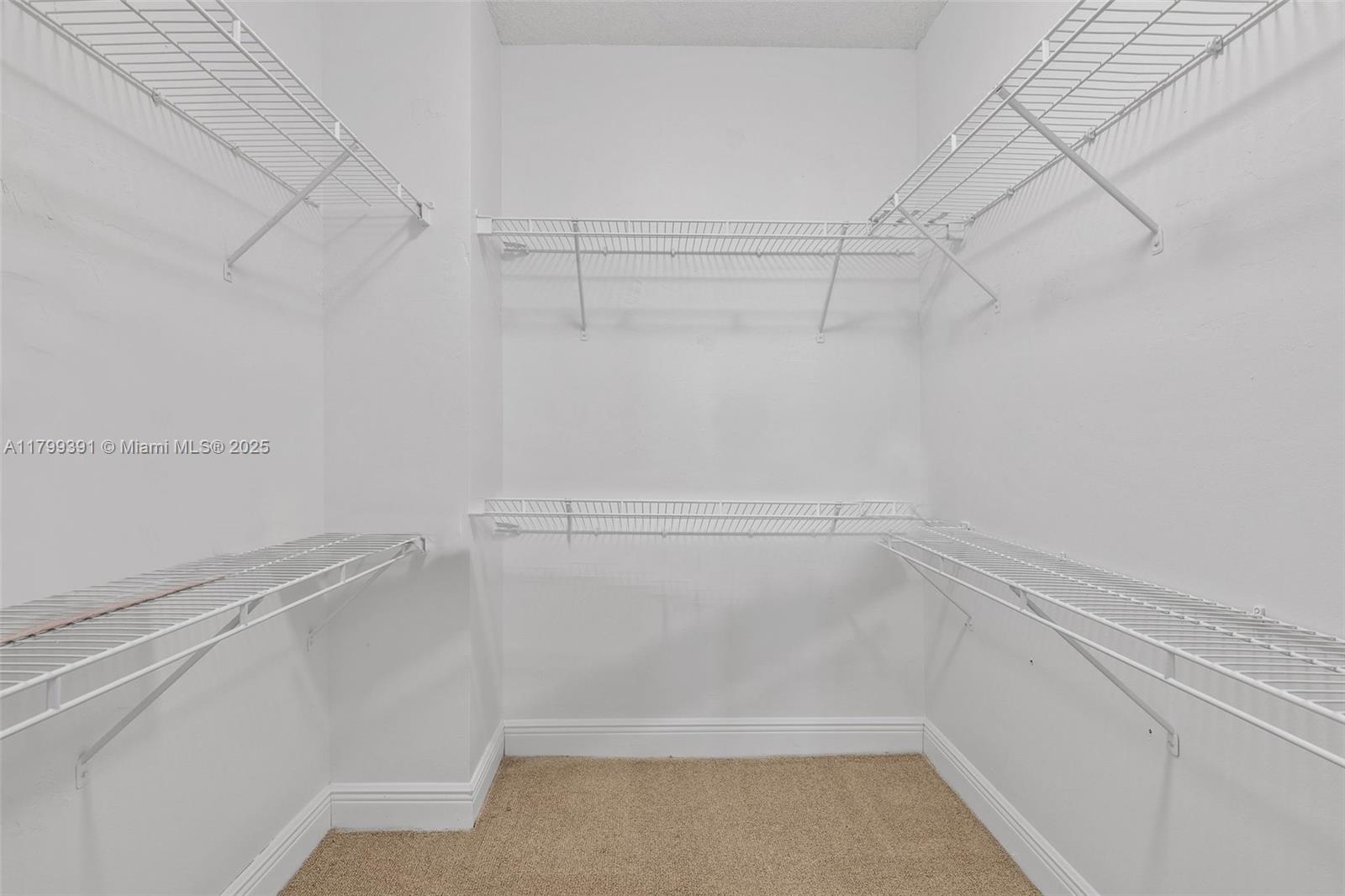 8401 Northwest 8th Street, Unit 401 Miami, FL 33126 - Photo 34 of 35 a view of a room with racks on the wall