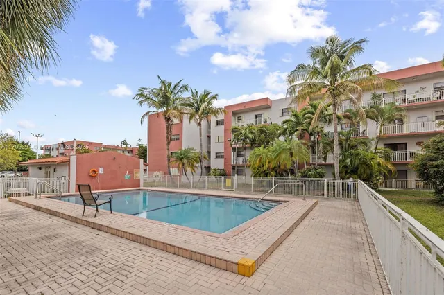 a view of a swimming pool with a patio