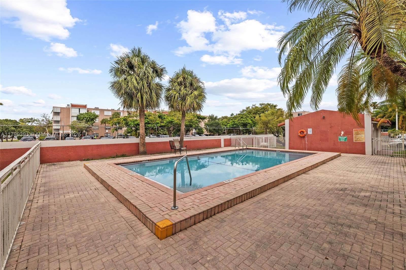 8401 Northwest 8th Street, Unit 401 Miami, FL 33126 - Photo 5 of 35 a view of a tennis ground with a large tree