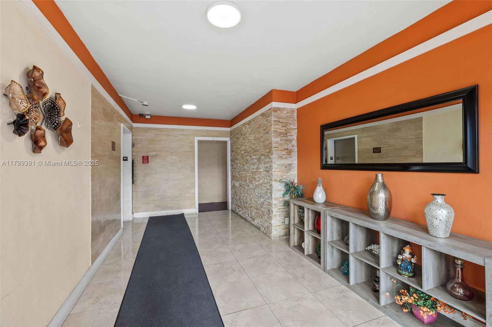 8401 Northwest 8th Street, Unit 401 Miami, FL 33126 - Photo 6 of 35 a hallway with windows and book shelf