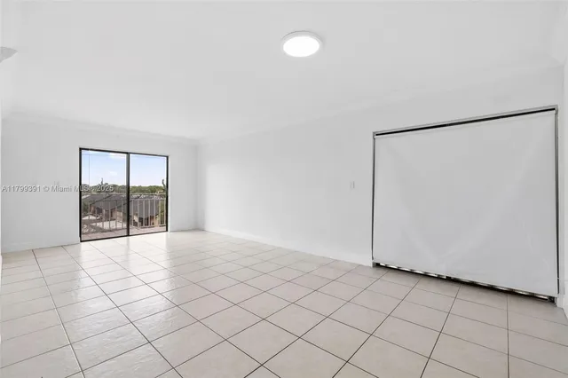 a view of an empty room and window