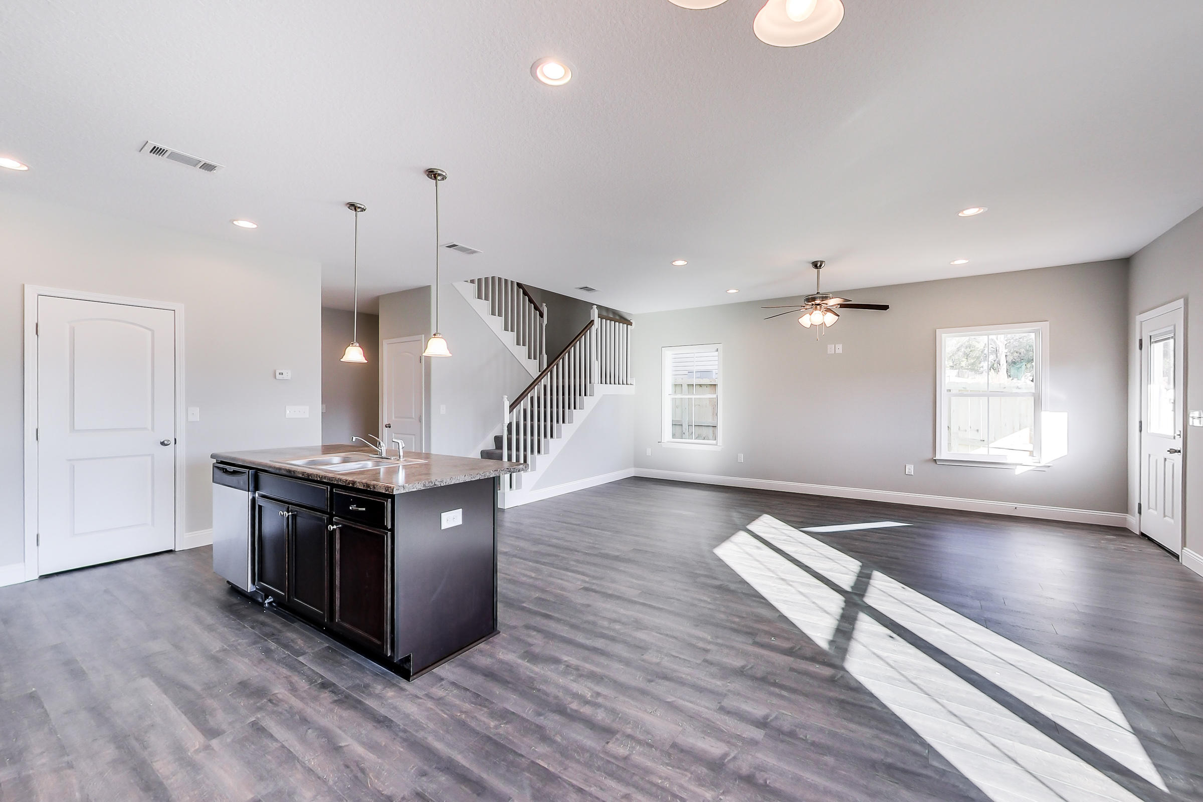 196 Johnson Court Crestview, FL 32536 - Photo 5 of 23 a kitchen with stainless steel appliances granite countertop a stove and a wooden floors
