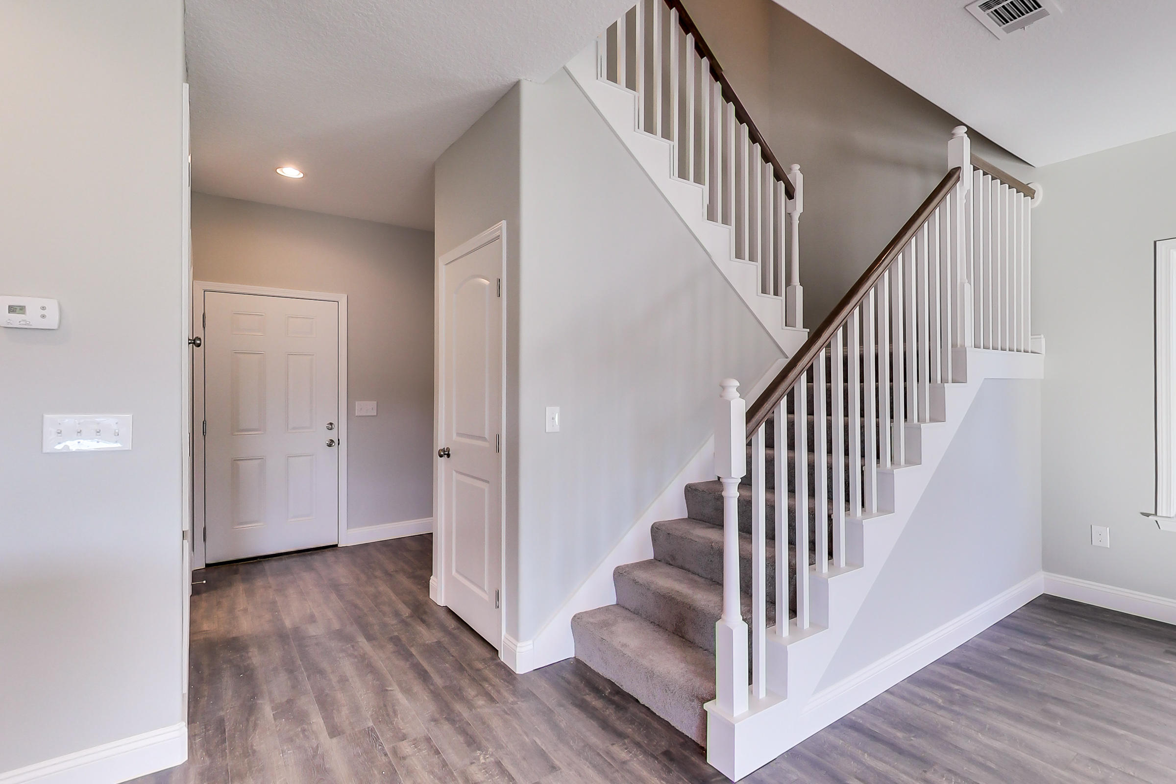 196 Johnson Court Crestview, FL 32536 - Photo 8 of 23 a view of a hallway with wooden floor and entryway