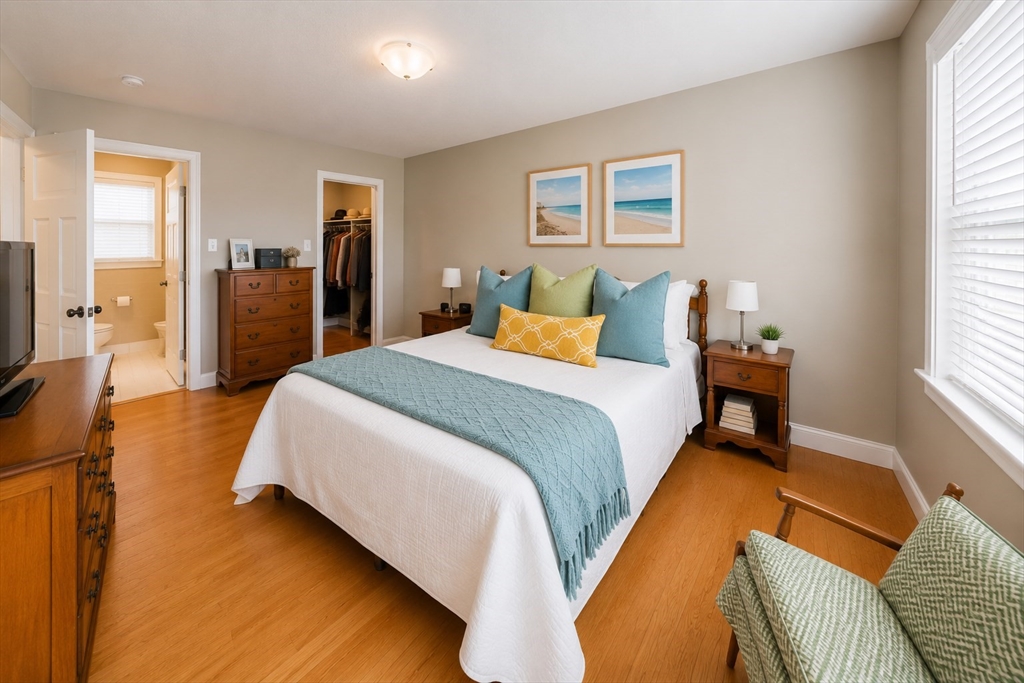 287 Wareham Street Middleboro, MA 02346 - Photo 10 of 28 a bedroom with a bed and wooden floor