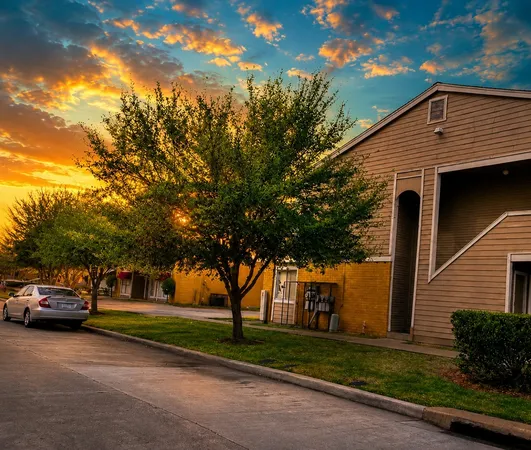 a view of a car park in front of a house