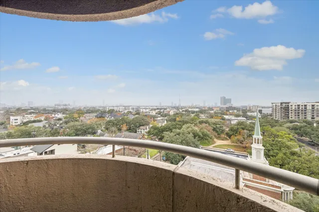a view of a city skyline from a balcony