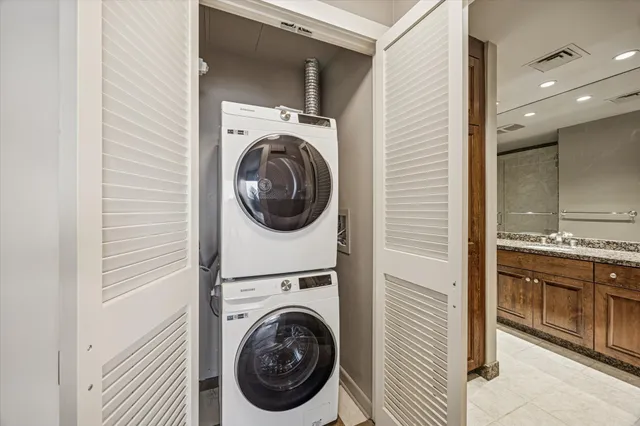 a view of a hallway with washer and dryer