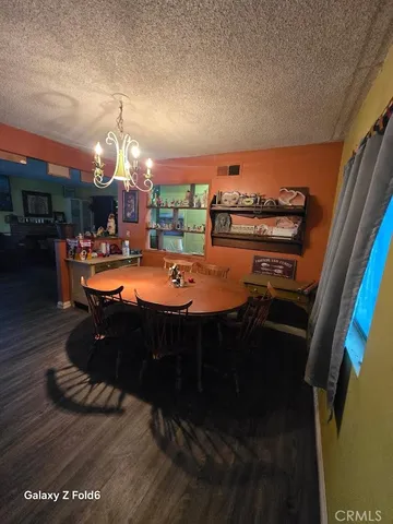 a outdoor dining space with furniture and a fireplace