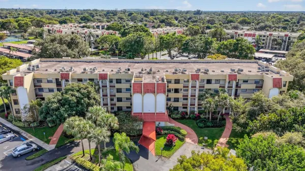 an aerial view of a multi story parking building
