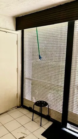 a view of a brick wall with exposed radiator