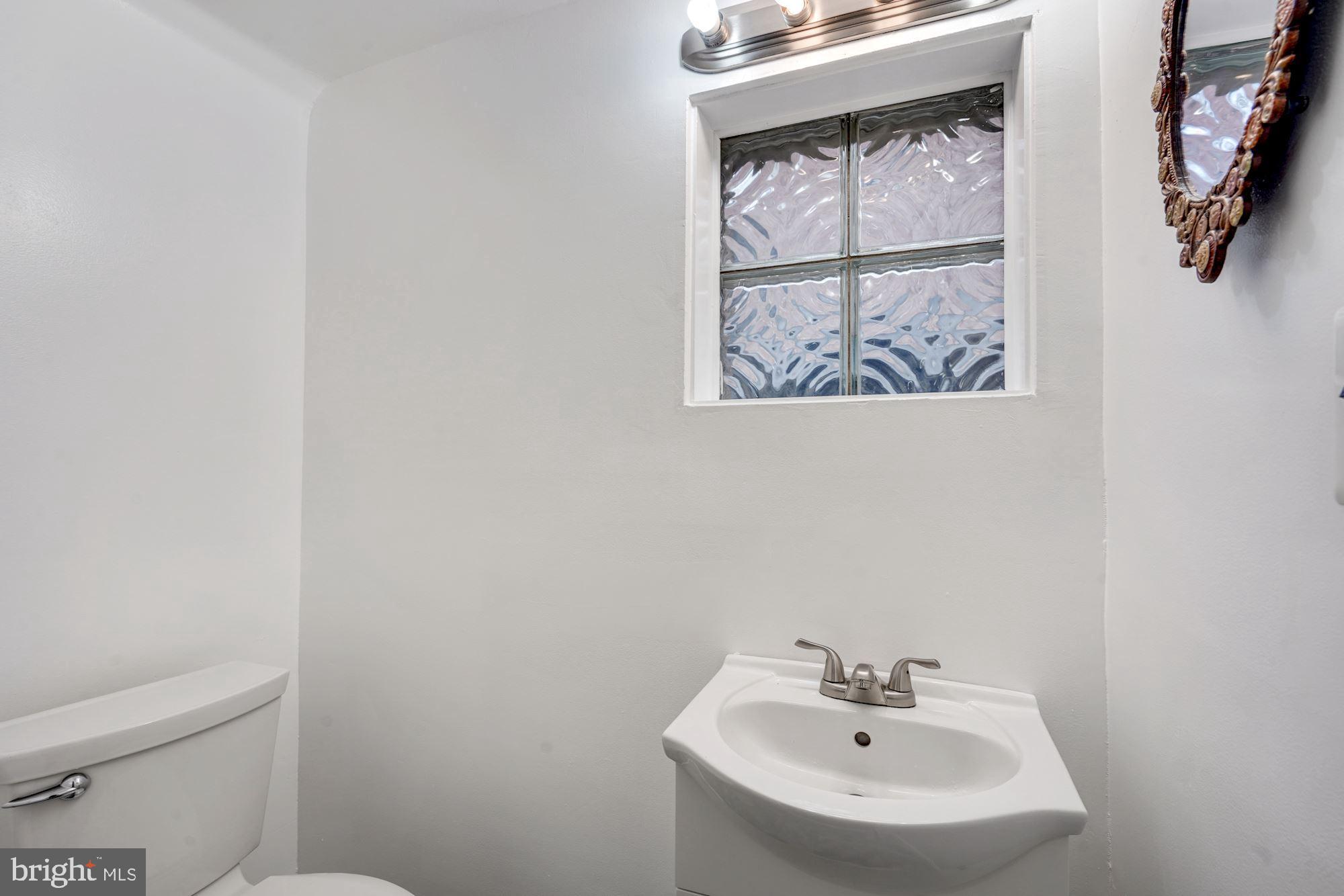 3209 19th Road North Arlington, VA 22201 - Photo 13 of 35 a bathroom with a sink and a toilet
