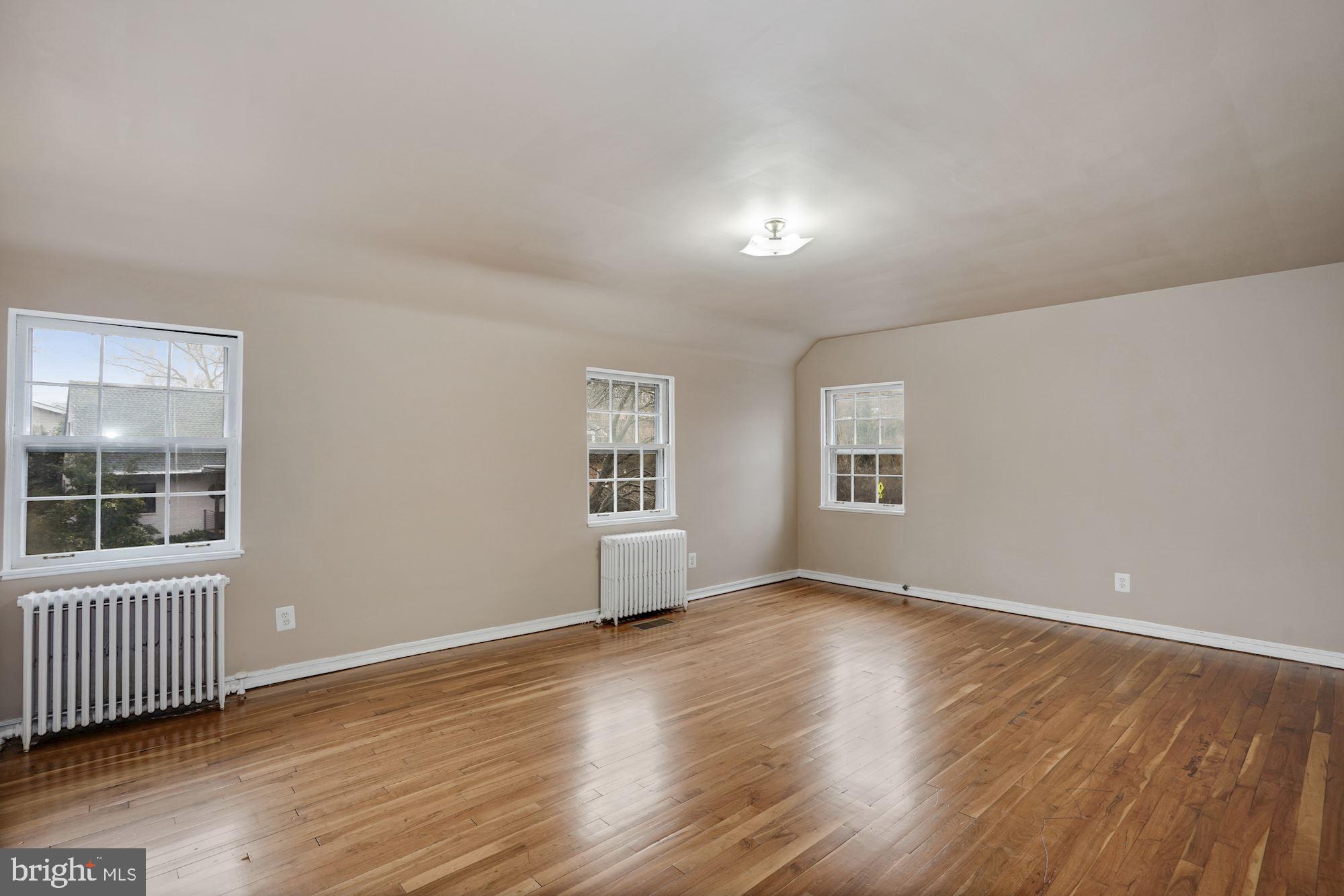 3209 19th Road North Arlington, VA 22201 - Photo 17 of 35 an empty room with wooden floor and windows