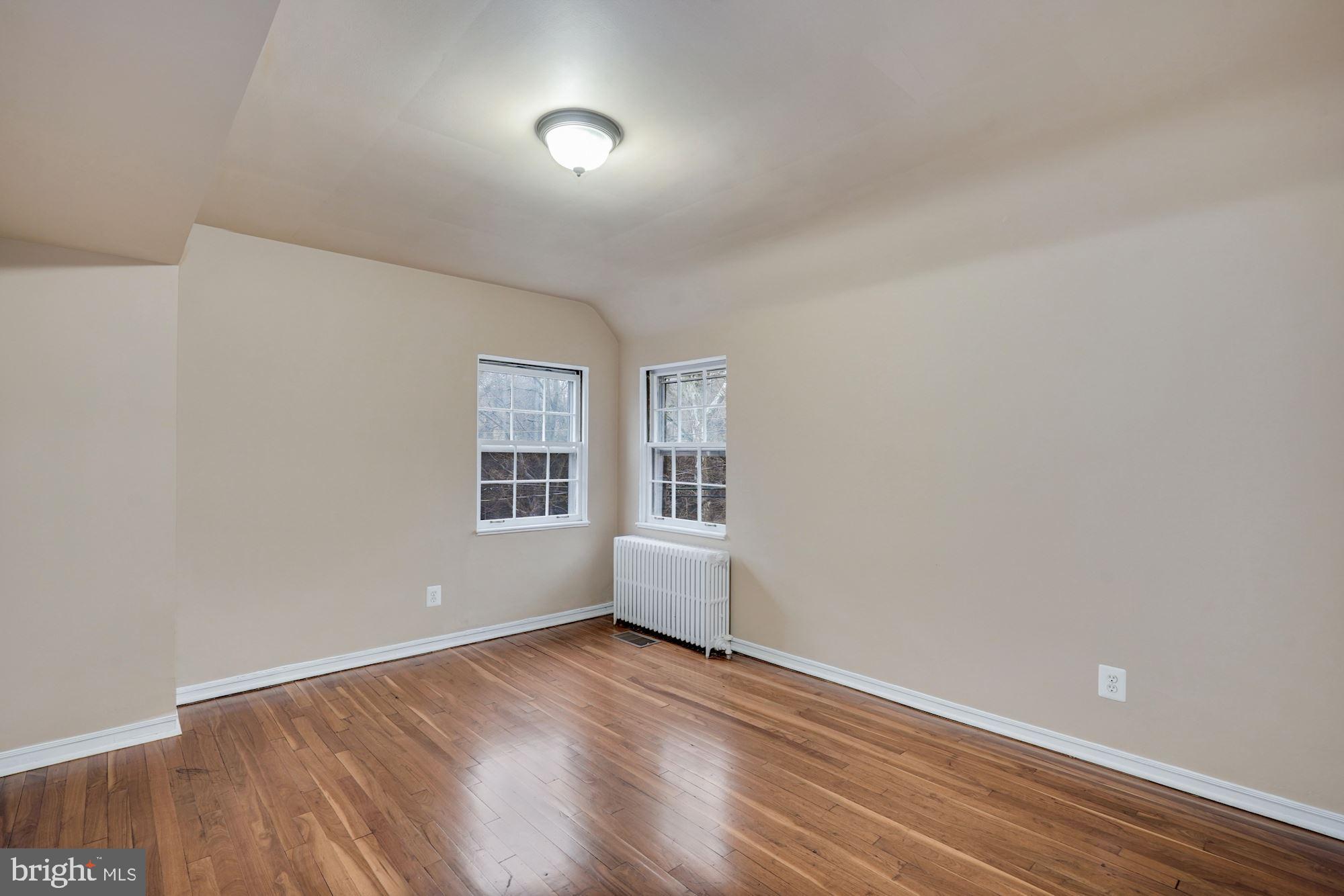3209 19th Road North Arlington, VA 22201 - Photo 19 of 35 a view of empty room with wooden floor and fan