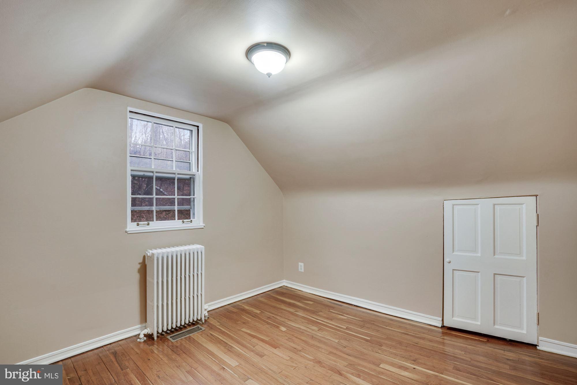 3209 19th Road North Arlington, VA 22201 - Photo 24 of 35 an empty room with wooden floor cabinet and windows