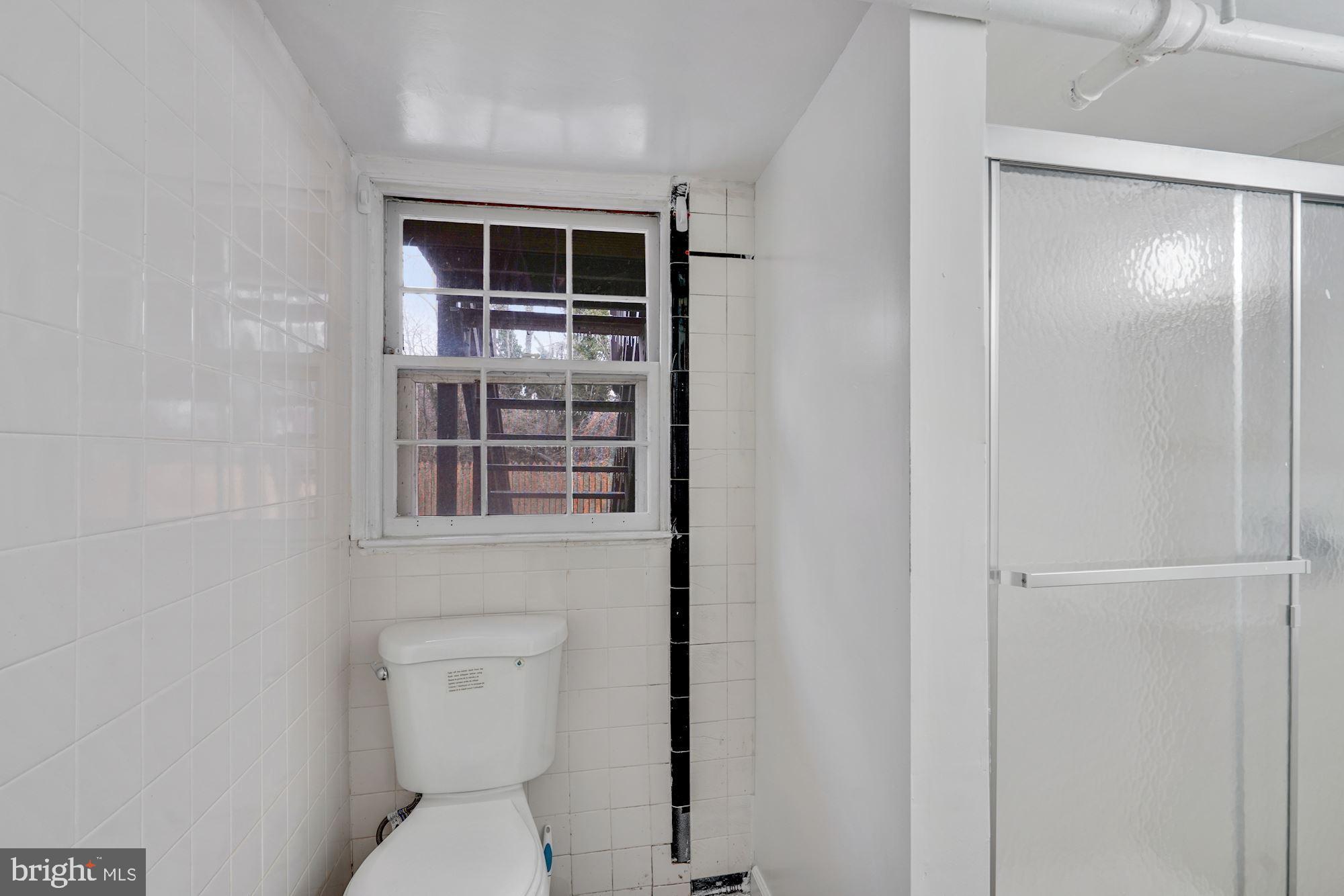 3209 19th Road North Arlington, VA 22201 - Photo 29 of 35 a bathroom with a toilet and a sink