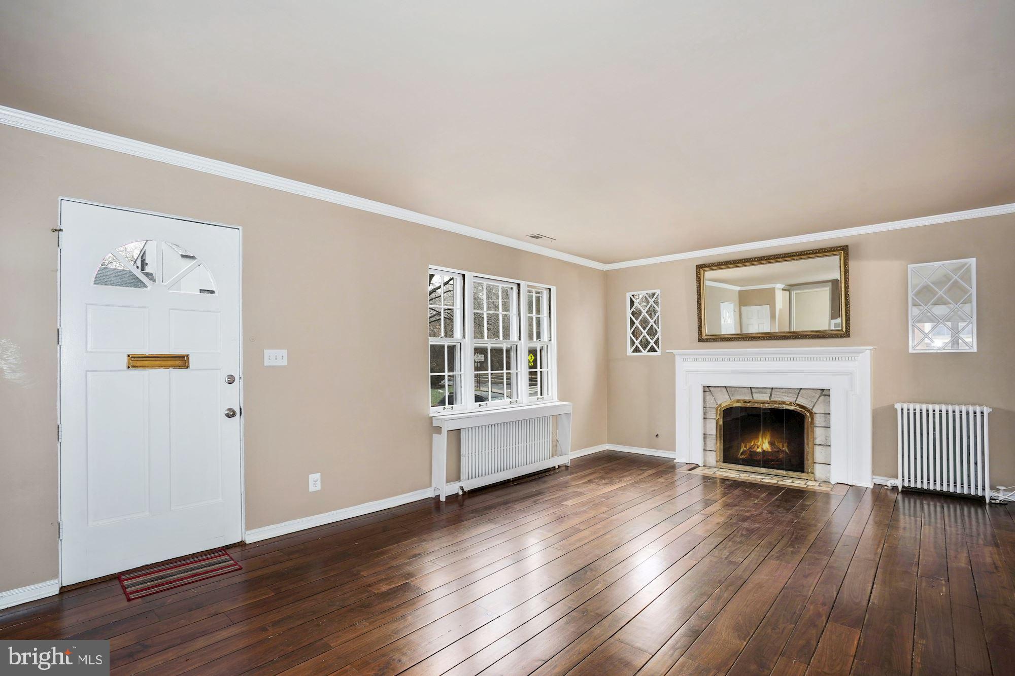 3209 19th Road North Arlington, VA 22201 - Photo 4 of 35 wooden floor fireplace and windows in an empty room