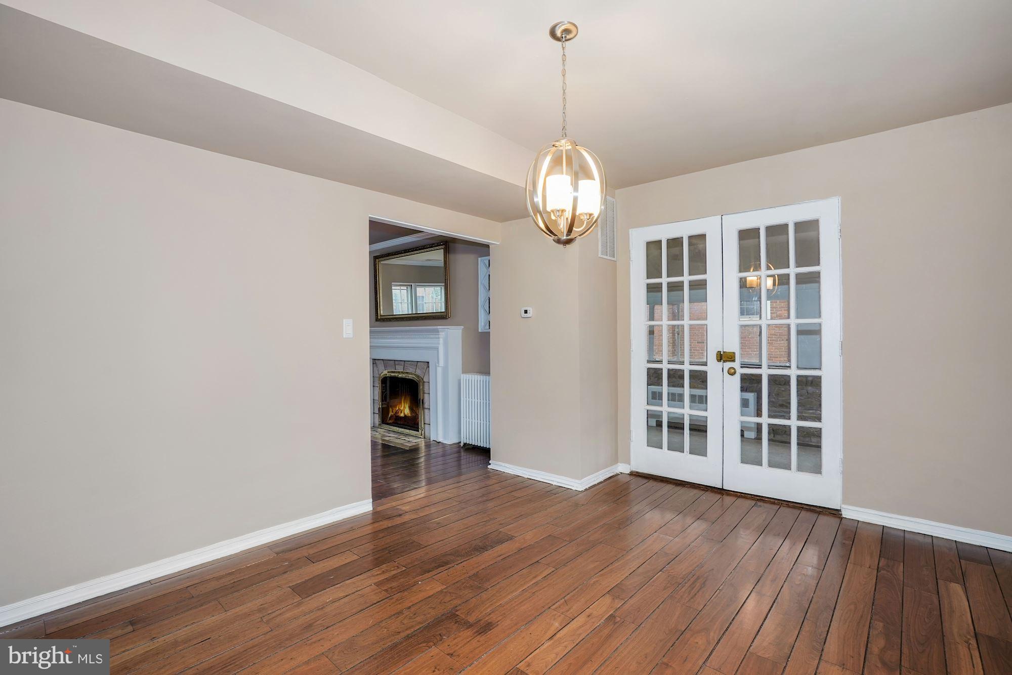 3209 19th Road North Arlington, VA 22201 - Photo 7 of 35 a view of a livingroom with wooden floor and chandelier