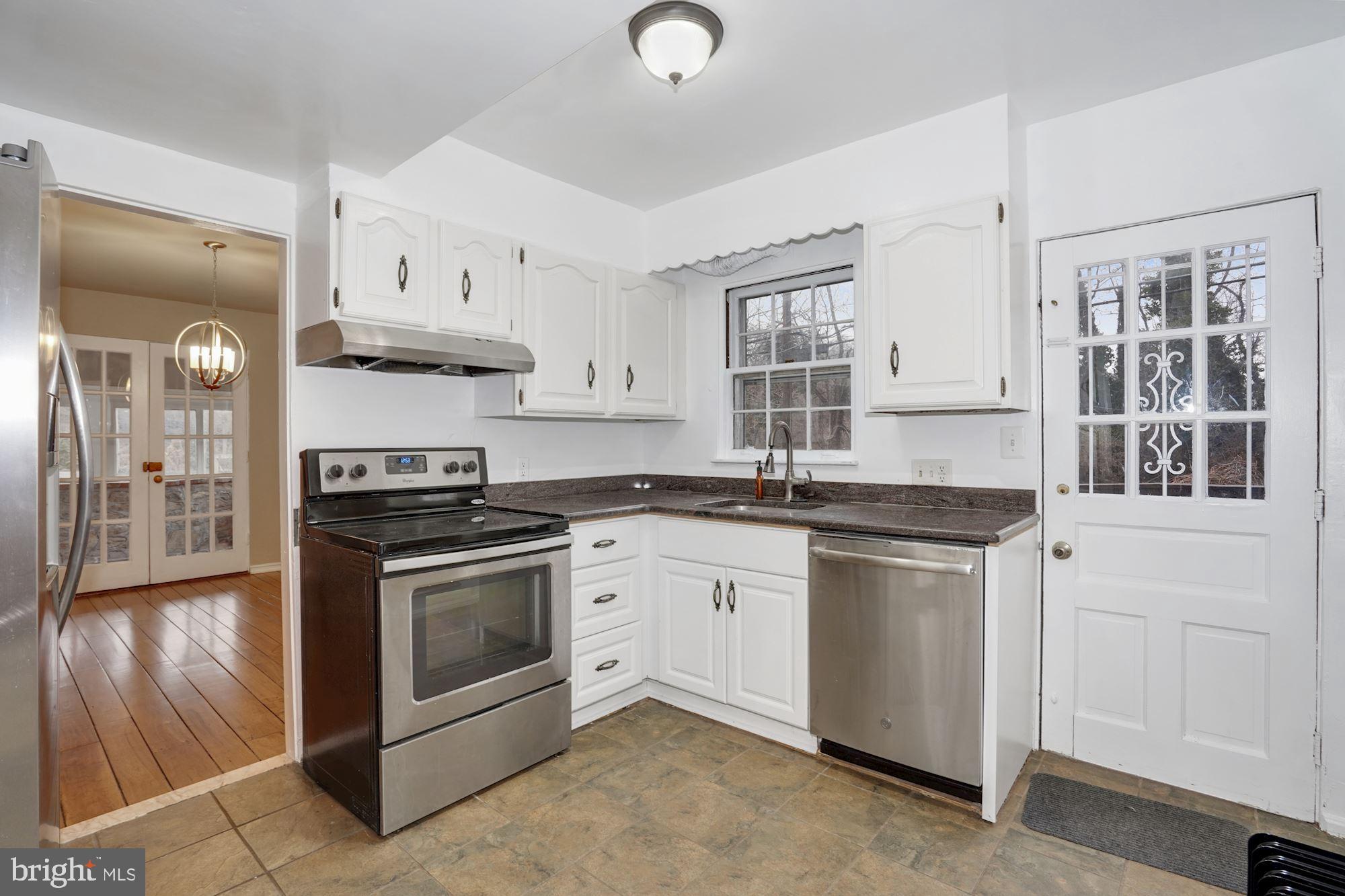 3209 19th Road North Arlington, VA 22201 - Photo 10 of 35 a kitchen with stainless steel appliances granite countertop a stove and a sink