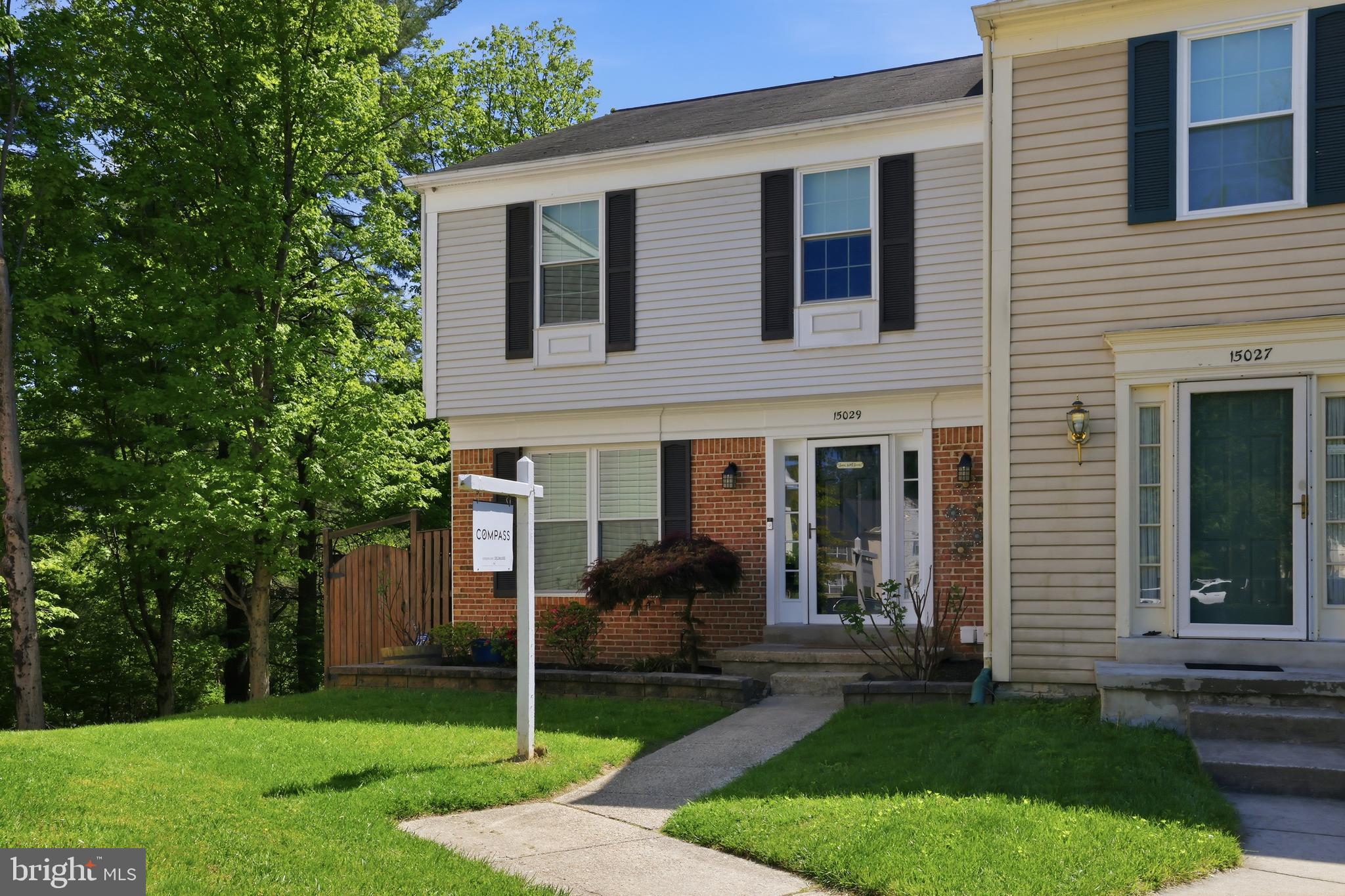 15029 Shamrock Ridge Road Silver Spring, MD 20906 - Photo 1 of 44 a view of a house with a yard and a large tree
